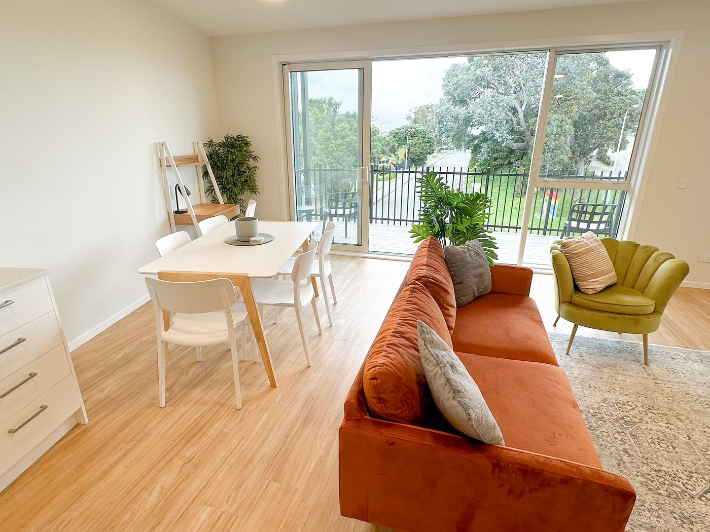 Open-plan living and dining area opening onto the balcony
